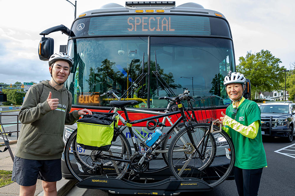 Bikes and Riders in Front of Metro Bus